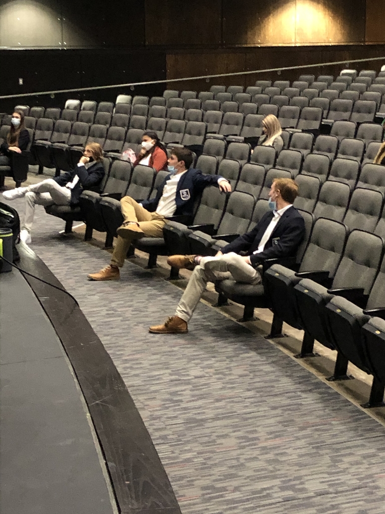 DECA students socially distanced sitting in the arena waiting for the conference