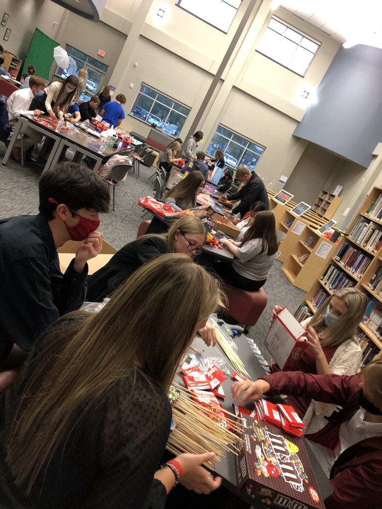 Students crafting and creating BOO-grams in the library