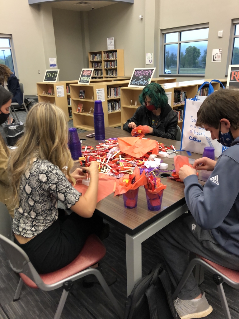 Students crafting and creating BOO-grams in the library