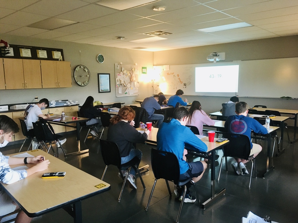 students sitting in class taking a test