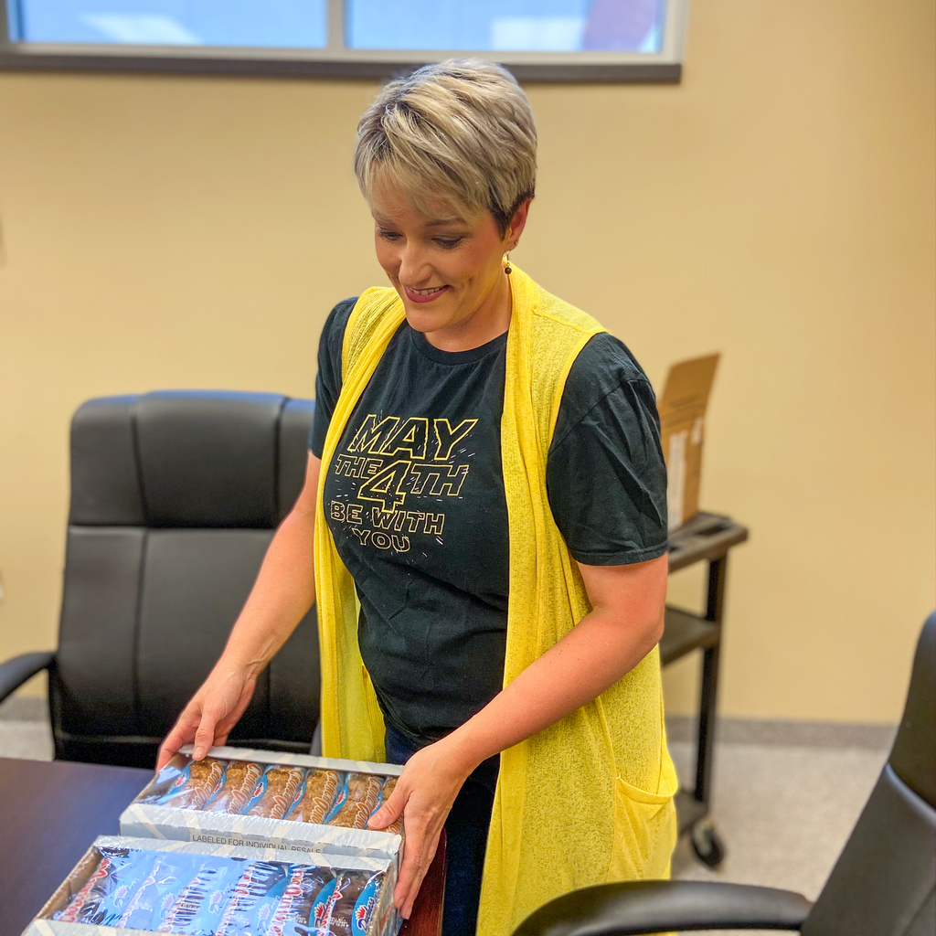 Earnheart handing out donuts for teachers