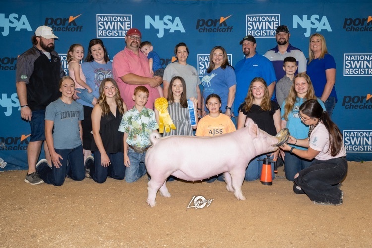 Shelby posing with her pig
