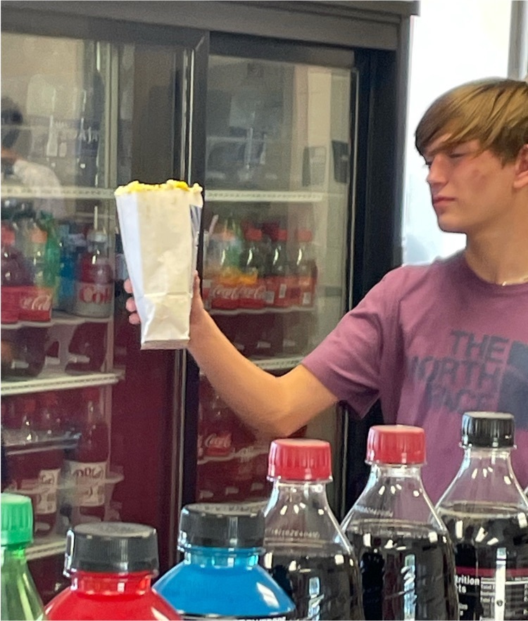 Evan serves popcorn