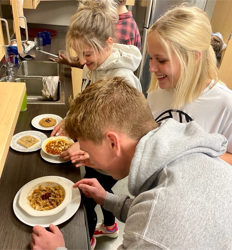 students cooking in school kitchen