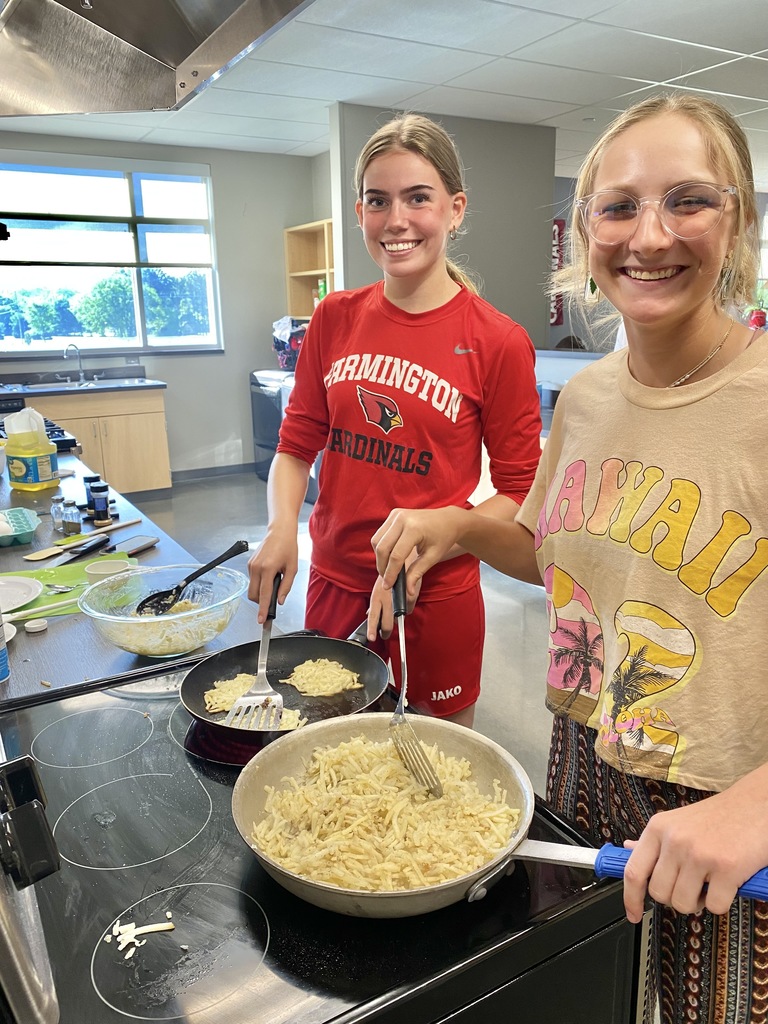 students cooking in home economics class.