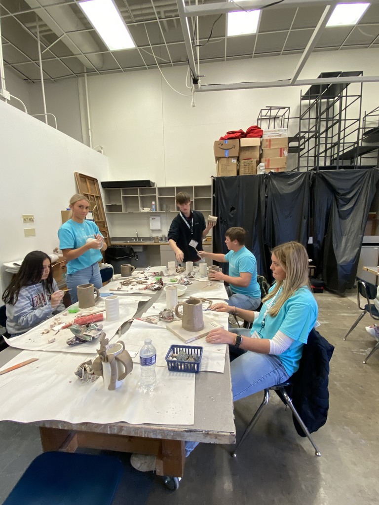 students making pottery 