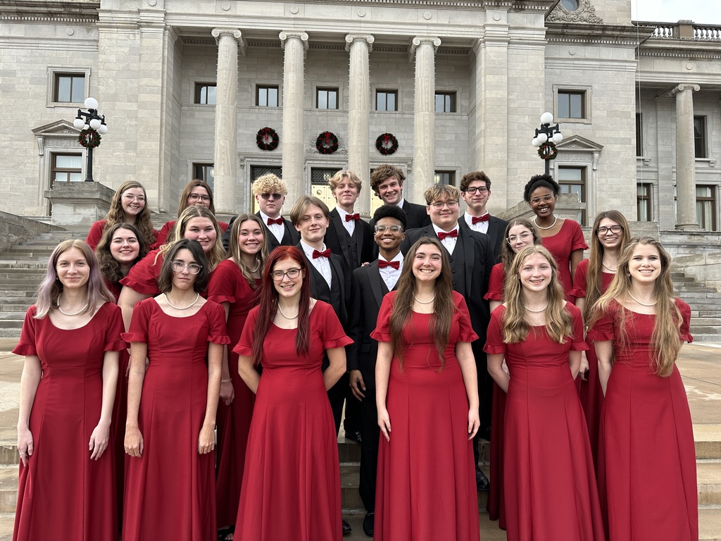 choir members lined up on the steps of the capital