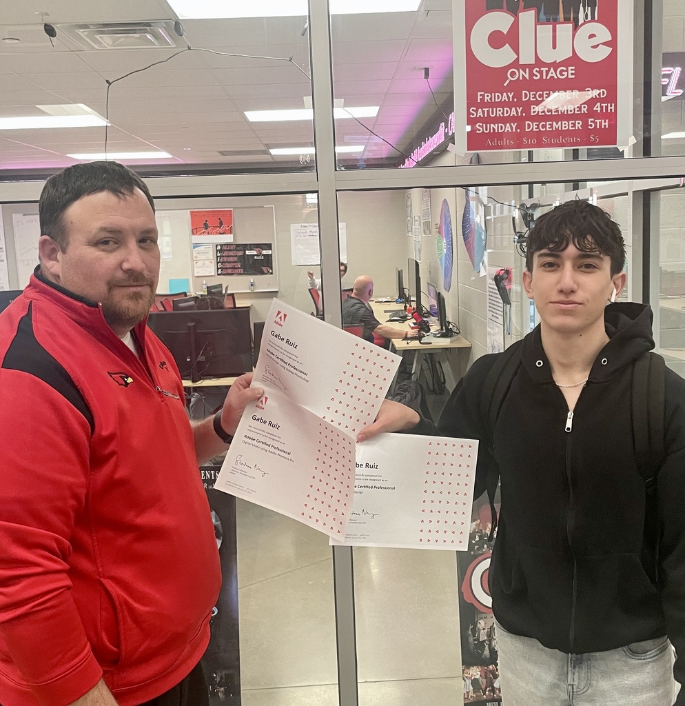 student posing with teacher and certificate