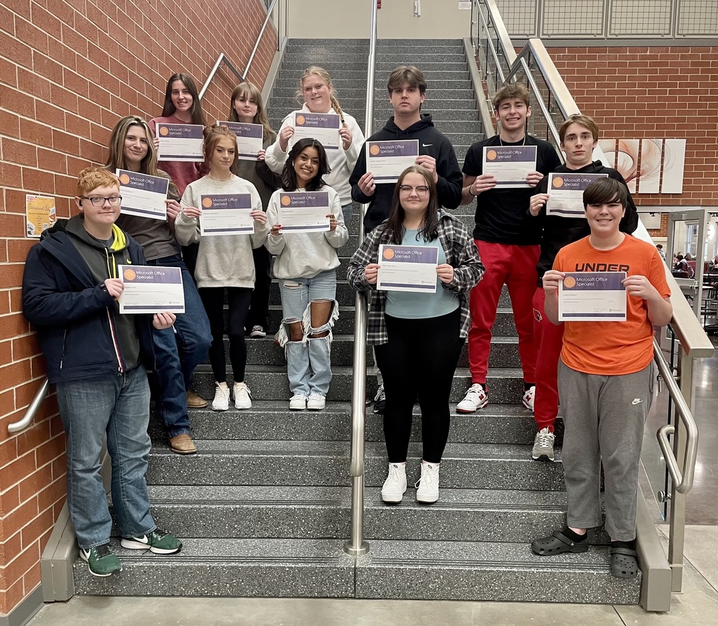 students posing with their certificates