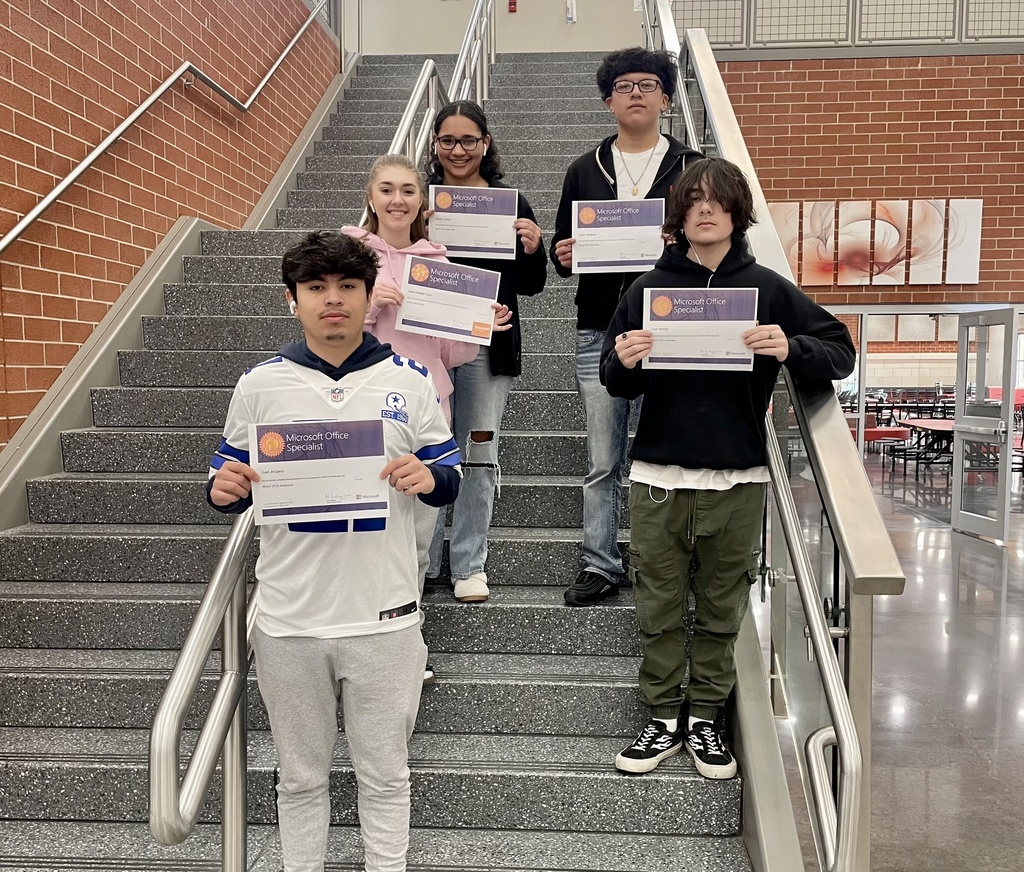 students posing with their certificates