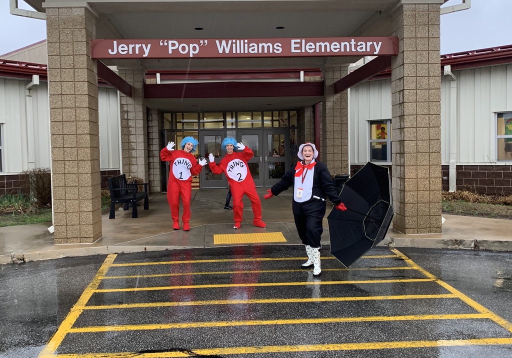 Thing 1, Thing 2, and the Cat in the Hat work the car drop-off line