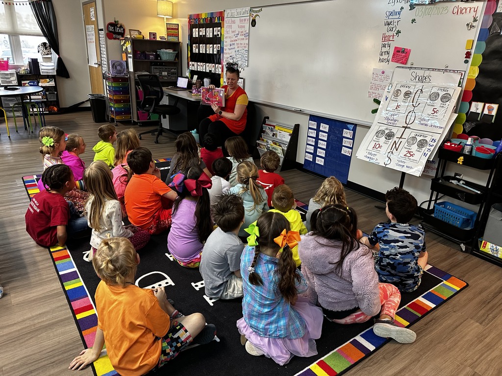 Mystery Reader reads to Mrs. Lewis' 1st grade class