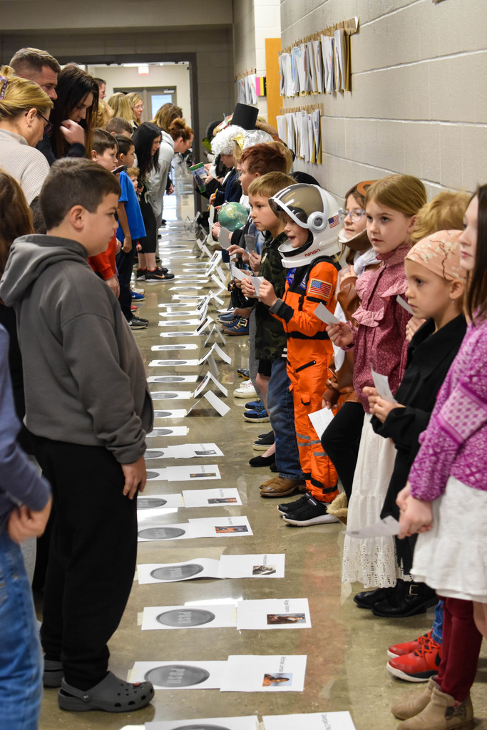 Students and guests line the hallway during the Wax Museum