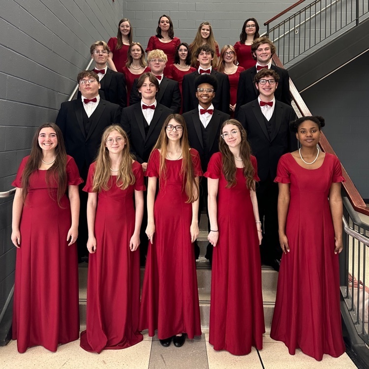 choir students posing in rows on stairs 