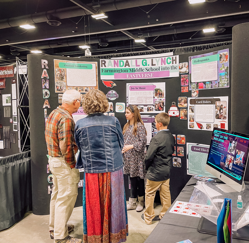 students working the EAST booth
