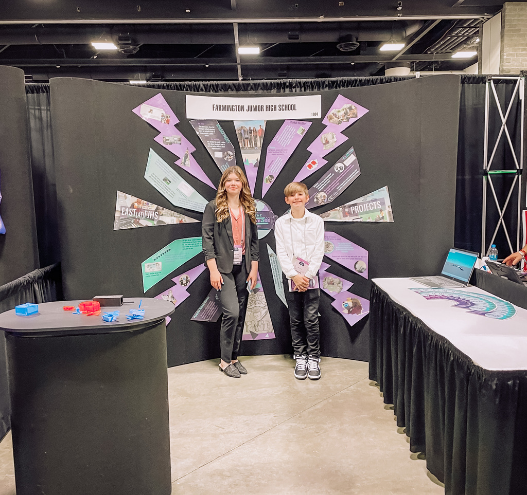 students working the EAST booth