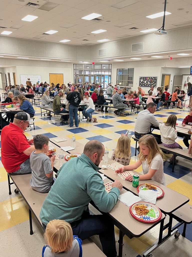 Families playing Bingo in the cafeteria
