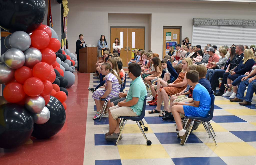 Students listen to Mrs. Gardenhire at the Moving Up ceremony